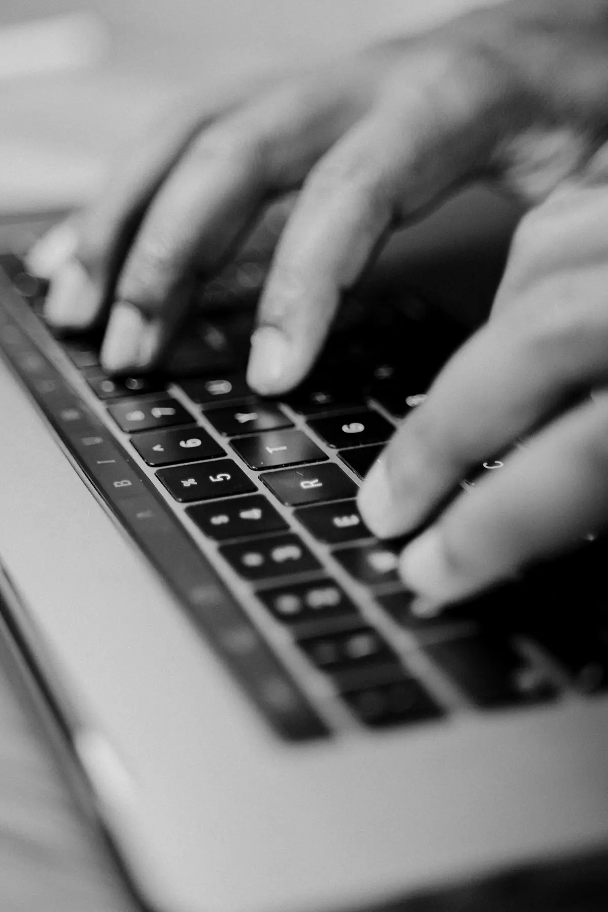 Hands on a keyboard sending an email