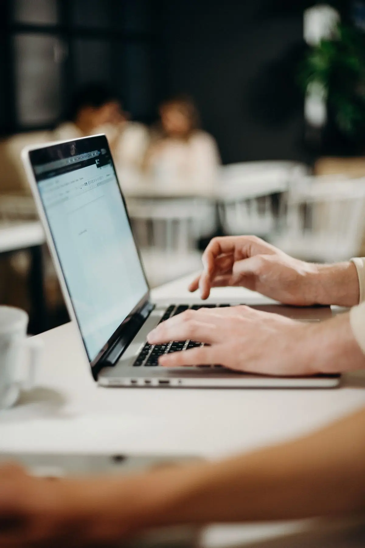 Writing a message on a laptop